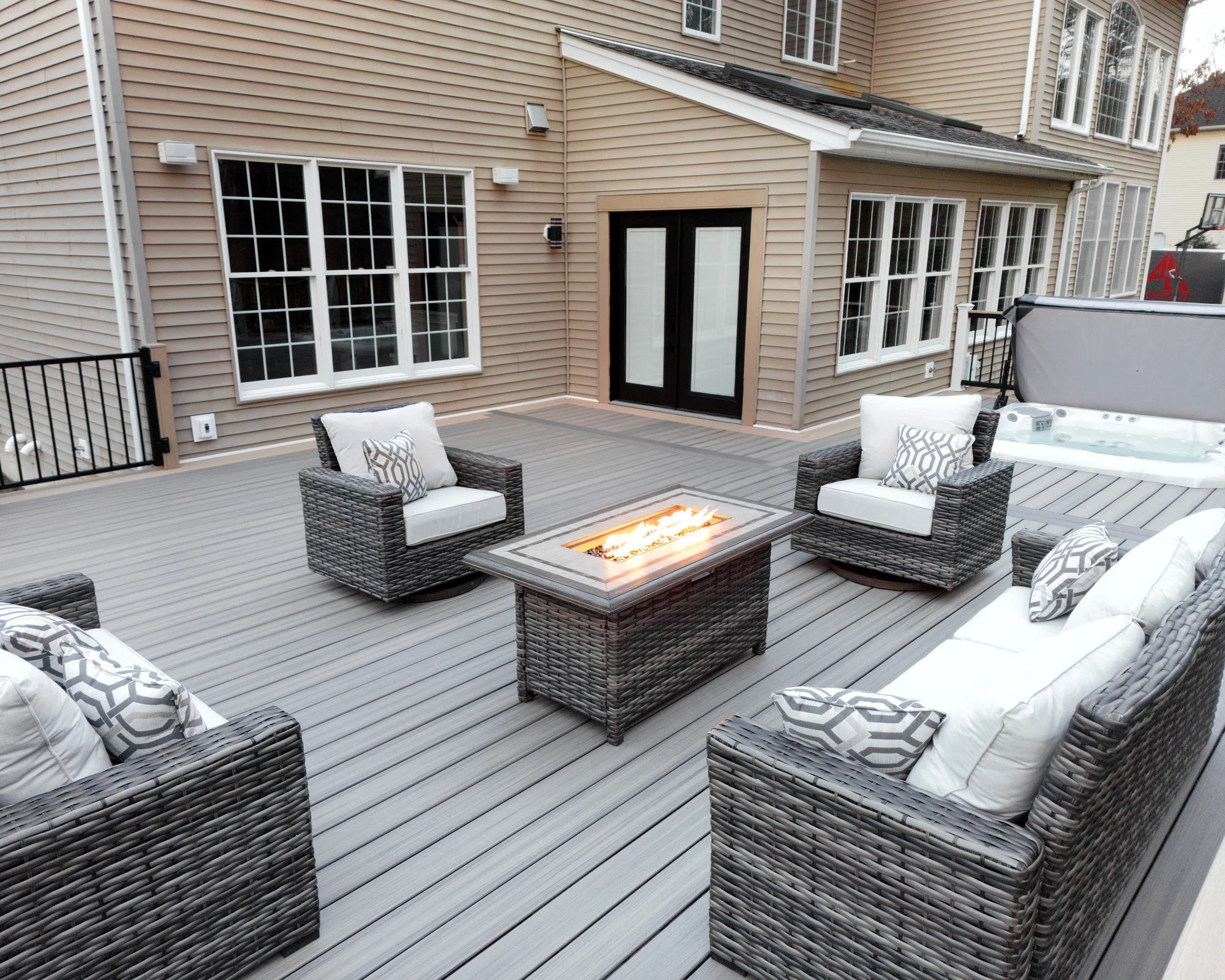 Covered deck lounge with a finished ceiling at dusk in the Hudson Valley