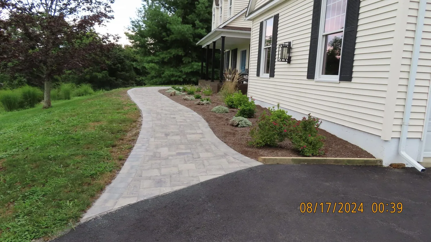 Curved paver patio and fire feature on a flat Dutchess lot