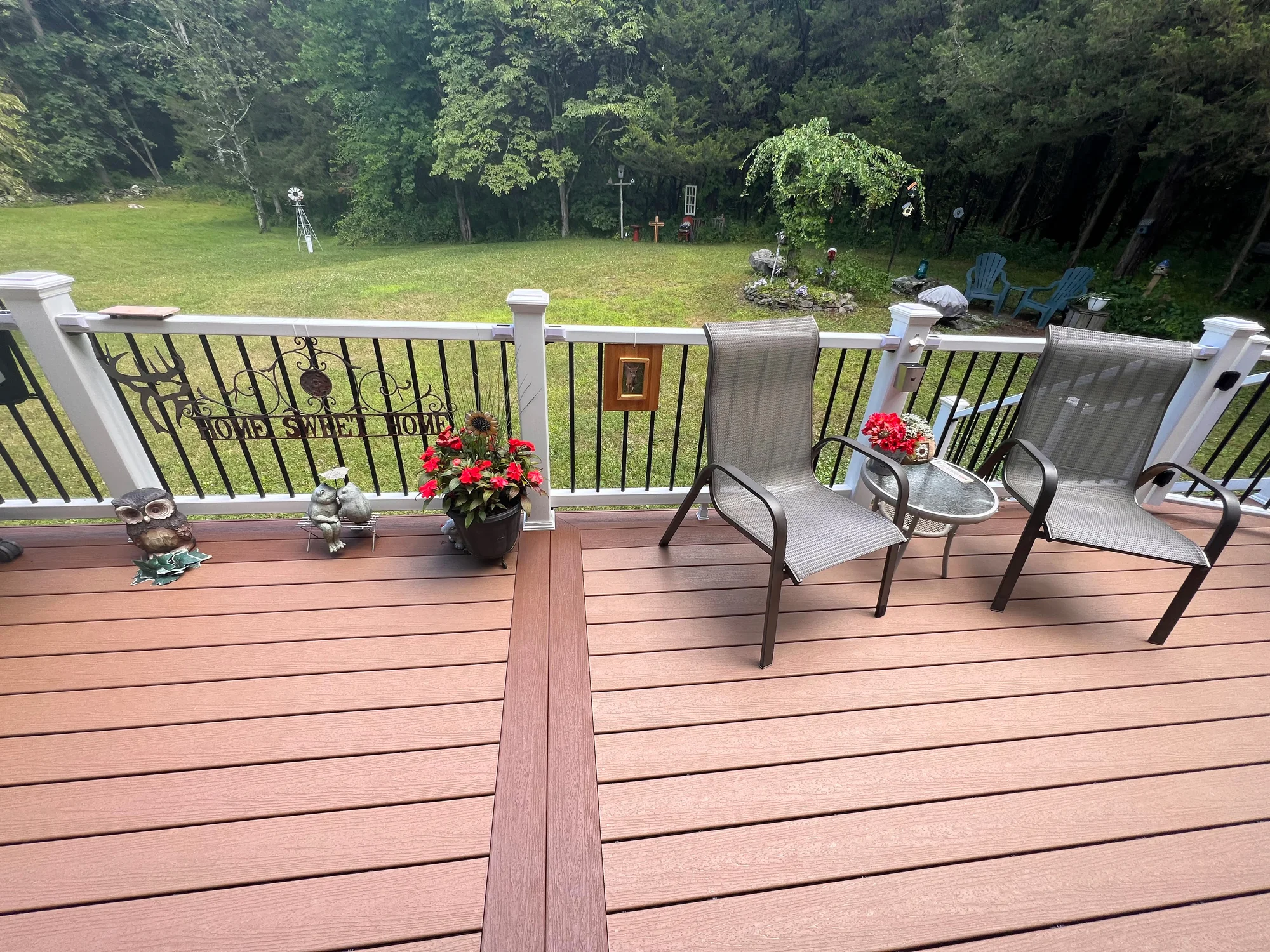 Trex Signature aluminum railing detail at dusk on a dark composite deck — Pinnacle Decking Hudson Valley NY
